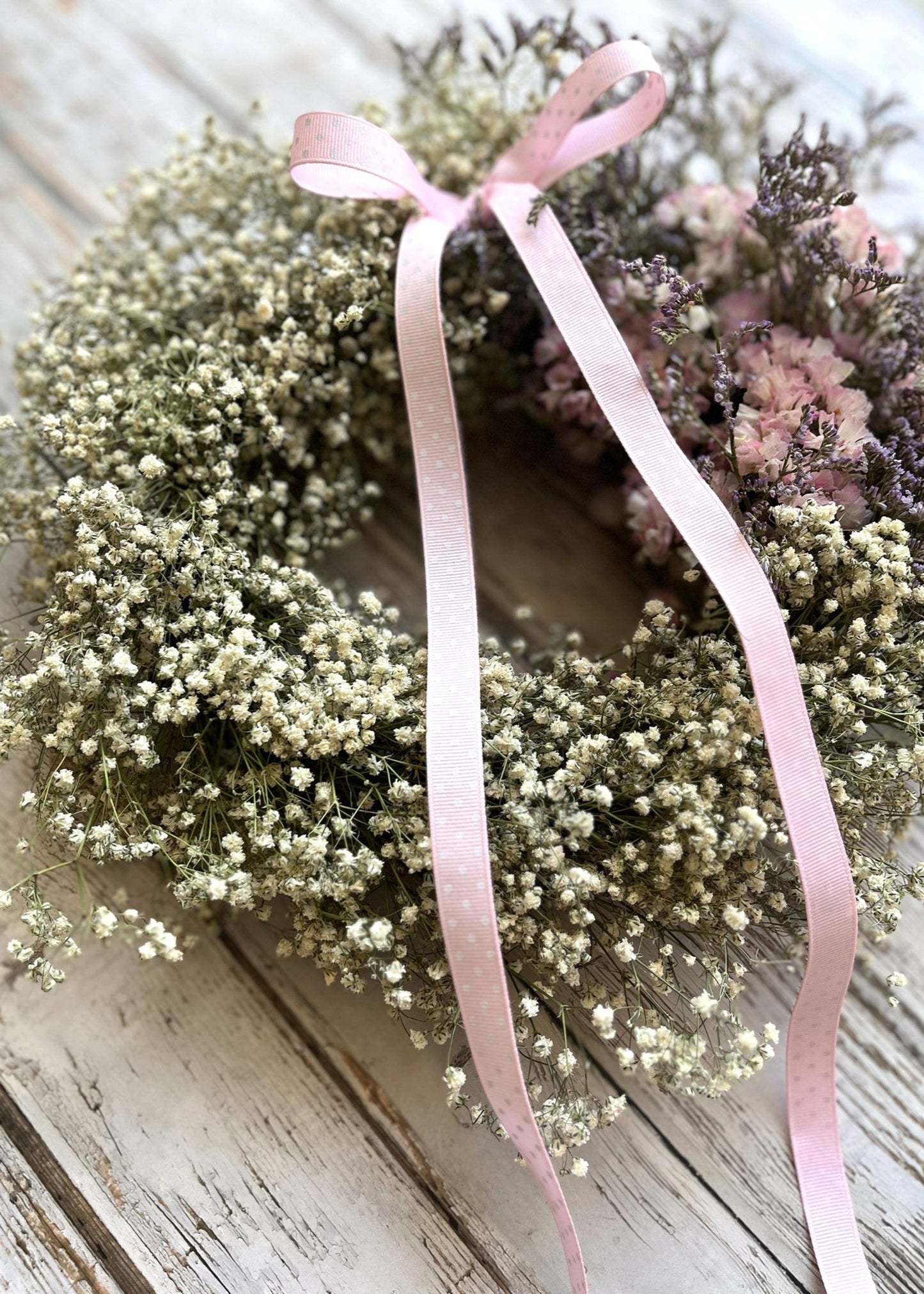 A pretty pink and white dried flower wreath with gypsophila—fresh from our spring range, full of soft textures and seasonal charm