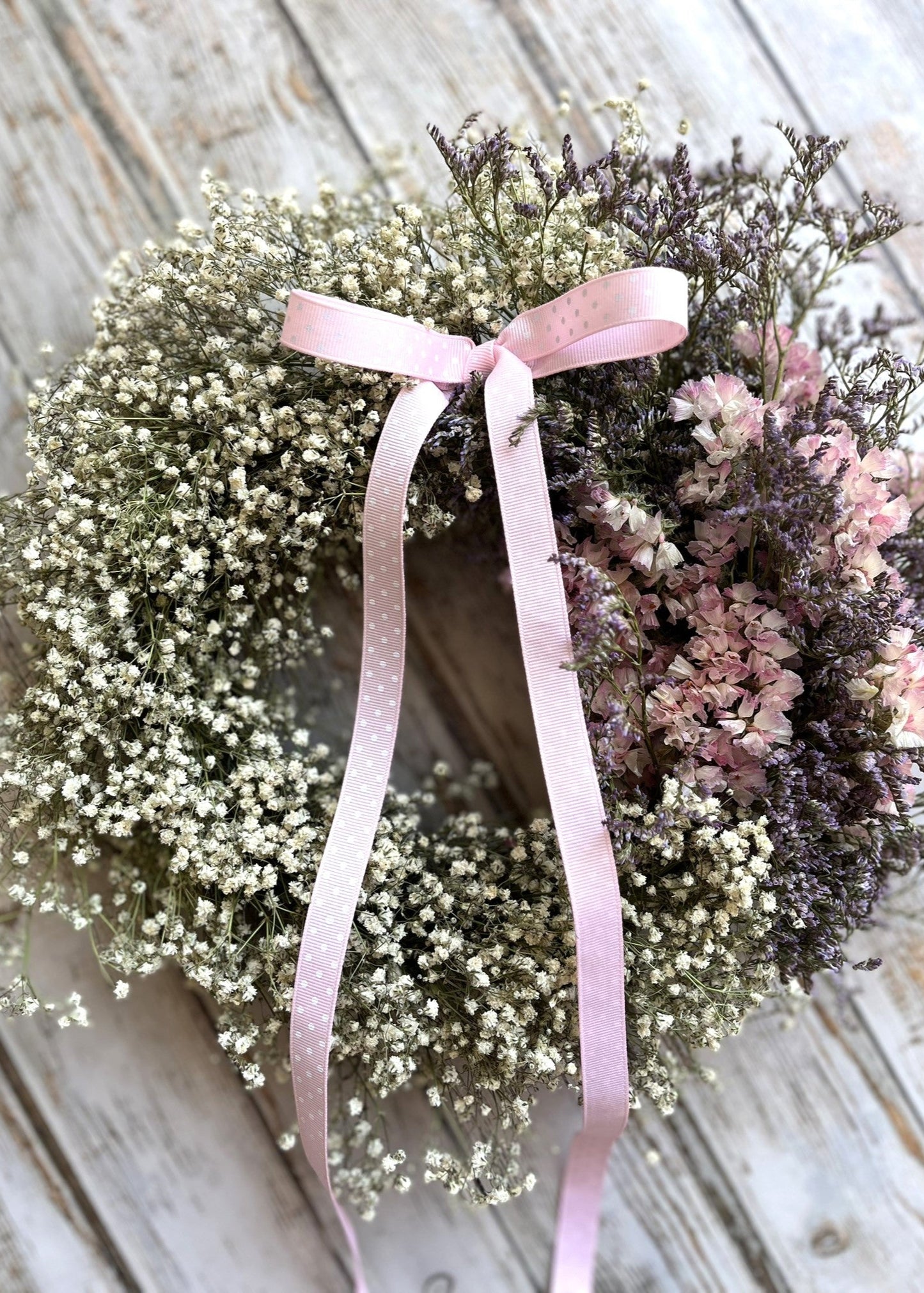 A pretty pink and white dried flower wreath with gypsophila—fresh from our spring range, full of soft textures and seasonal charm