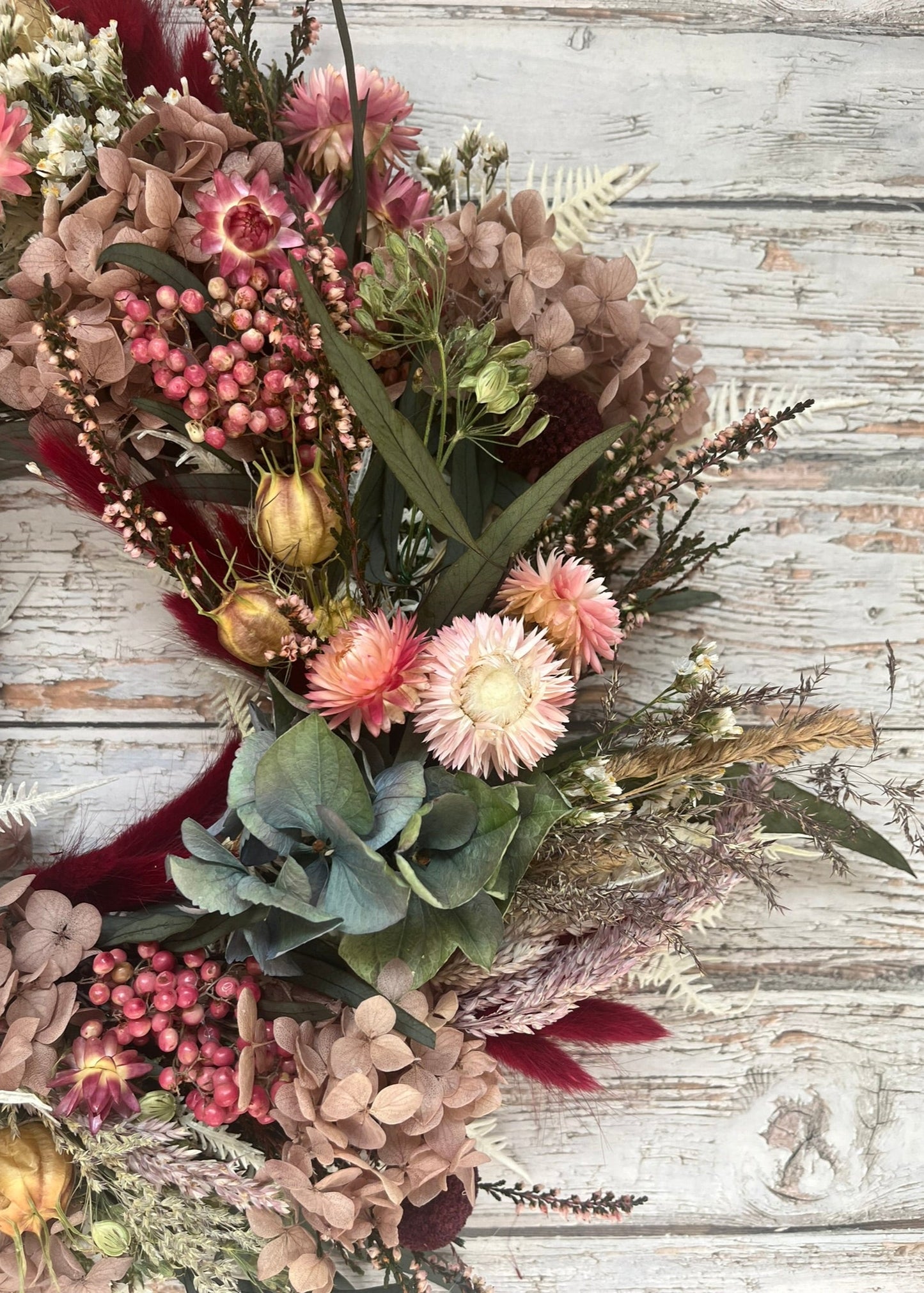 Bouquet of dried flowers on a wooden surface