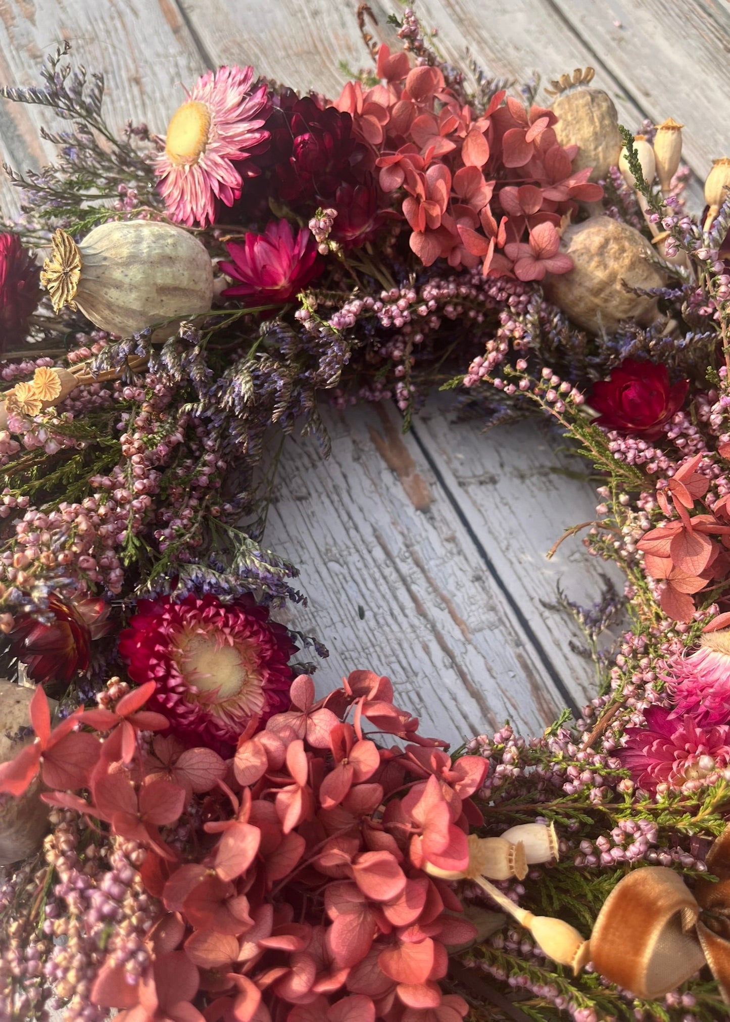 Dried flower wreath on a wooden surface