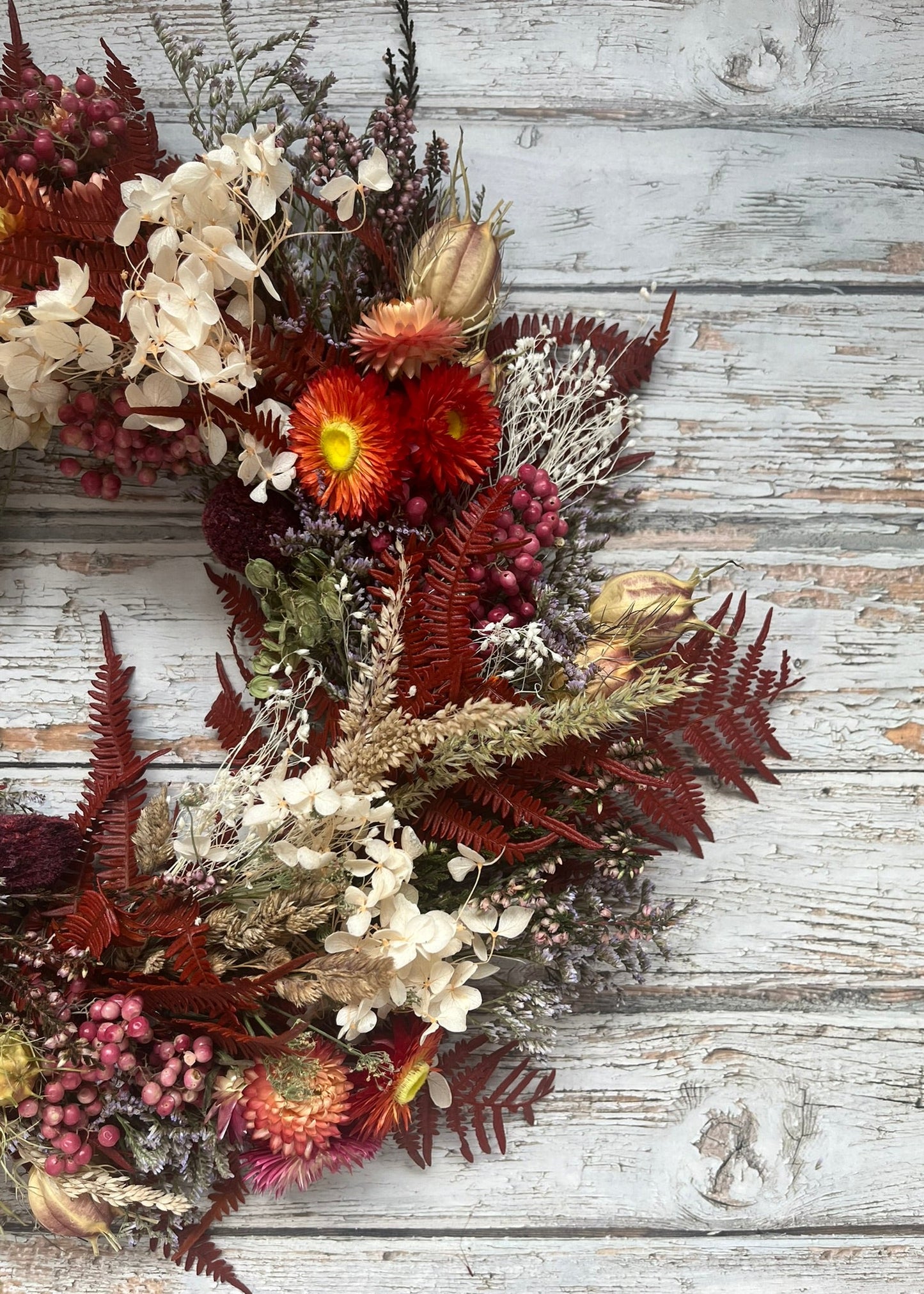 Dried floral arrangement on a wooden surface