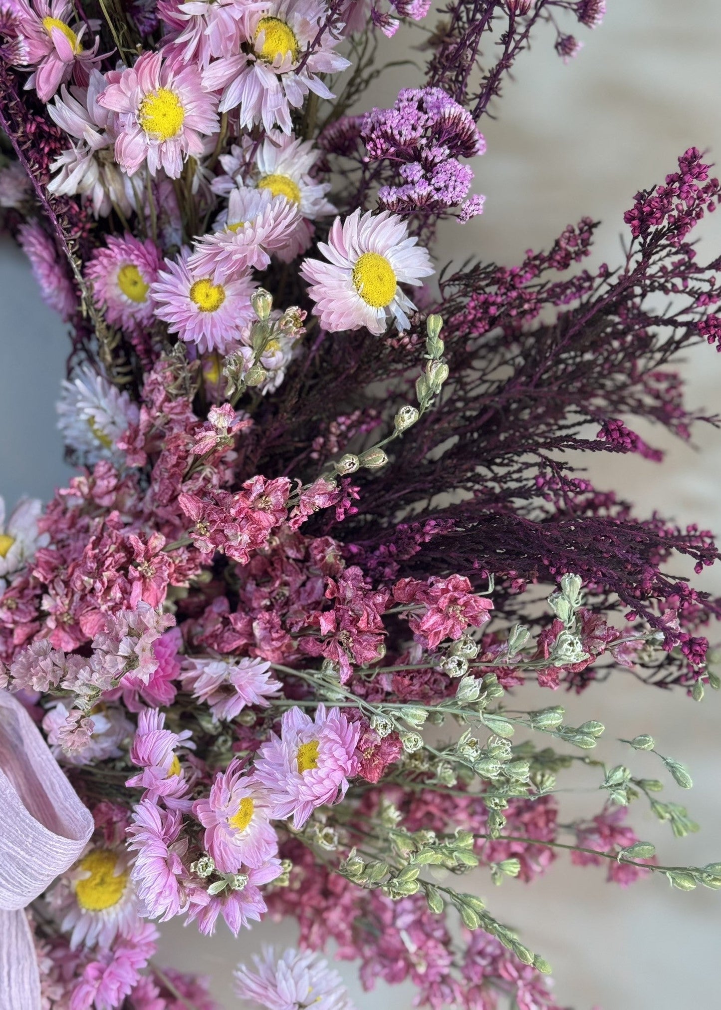 Bouquet of pink, white, and purple flowers with a blurred background