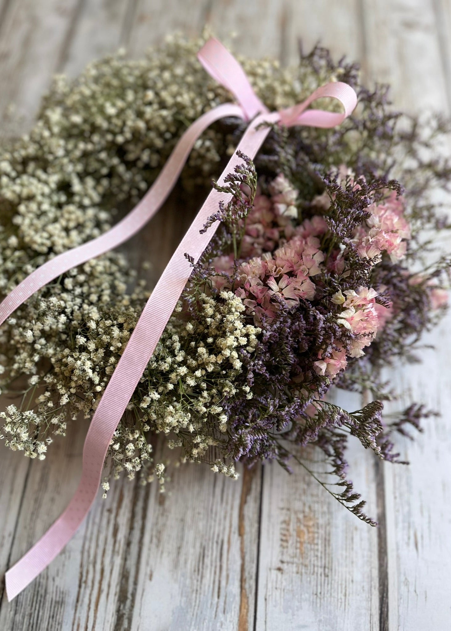 A pretty pink and white dried flower wreath with gypsophila—fresh from our spring range, full of soft textures and seasonal charm