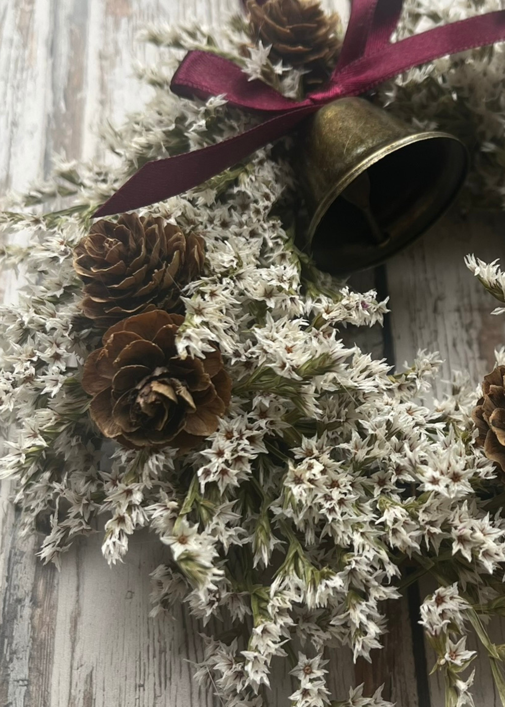 Mini white and burgundy dried flower wreath with brass bell