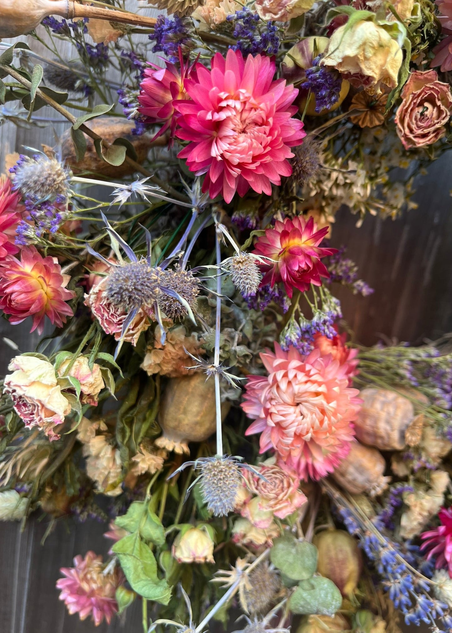 summer flowery dried flower wreath in pink and blue shades