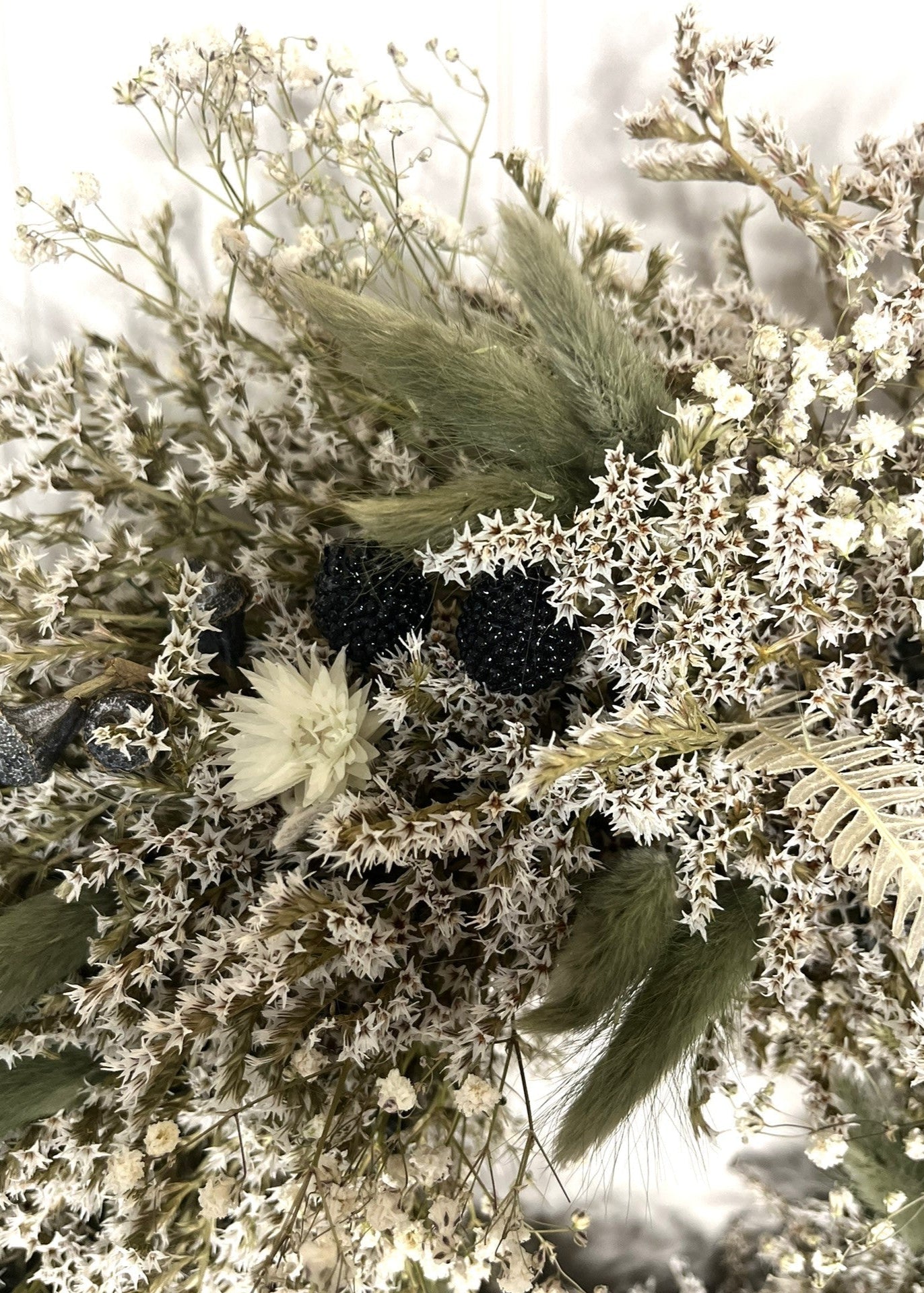 Close-up of a bouquet with dried flowers and herbs